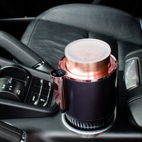 a coffee cup sitting on top of a cup holder in a car