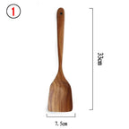 Teak wood kitchen turner from Thailand, measuring 33cm in length and 7.5cm in width. Durable and eco-friendly, perfect for cooking and serving.