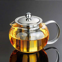 Elegant Flower Glass Teapot on a dining table