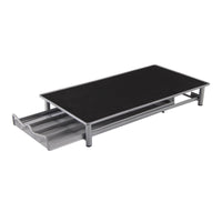 a metal table with a black table top