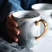 Ceramic Mug with Marble Pattern and Gold Handle in a kitchen setting