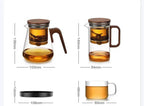 One-Click Filtering Glass Teapot with walnut wood handle and durable glass liner. Features an easy-to-use filtering system for effortless tea brewing.