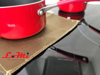 a red pot sitting on top of a stove