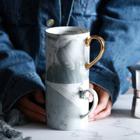 Close-up of the Marble Pattern and Gold Handle on the Ceramic Mug