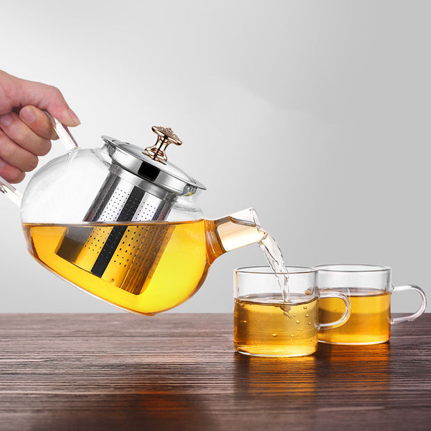 Elegant glass teapot showcasing tea brewing process"