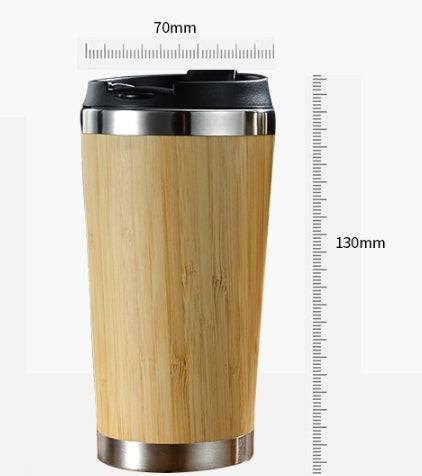 Bamboo coffee cup with 14oz capacity, featuring double-wall insulation and a non-slip grip. Eco-friendly, reusable, and ideal for sustainable living.