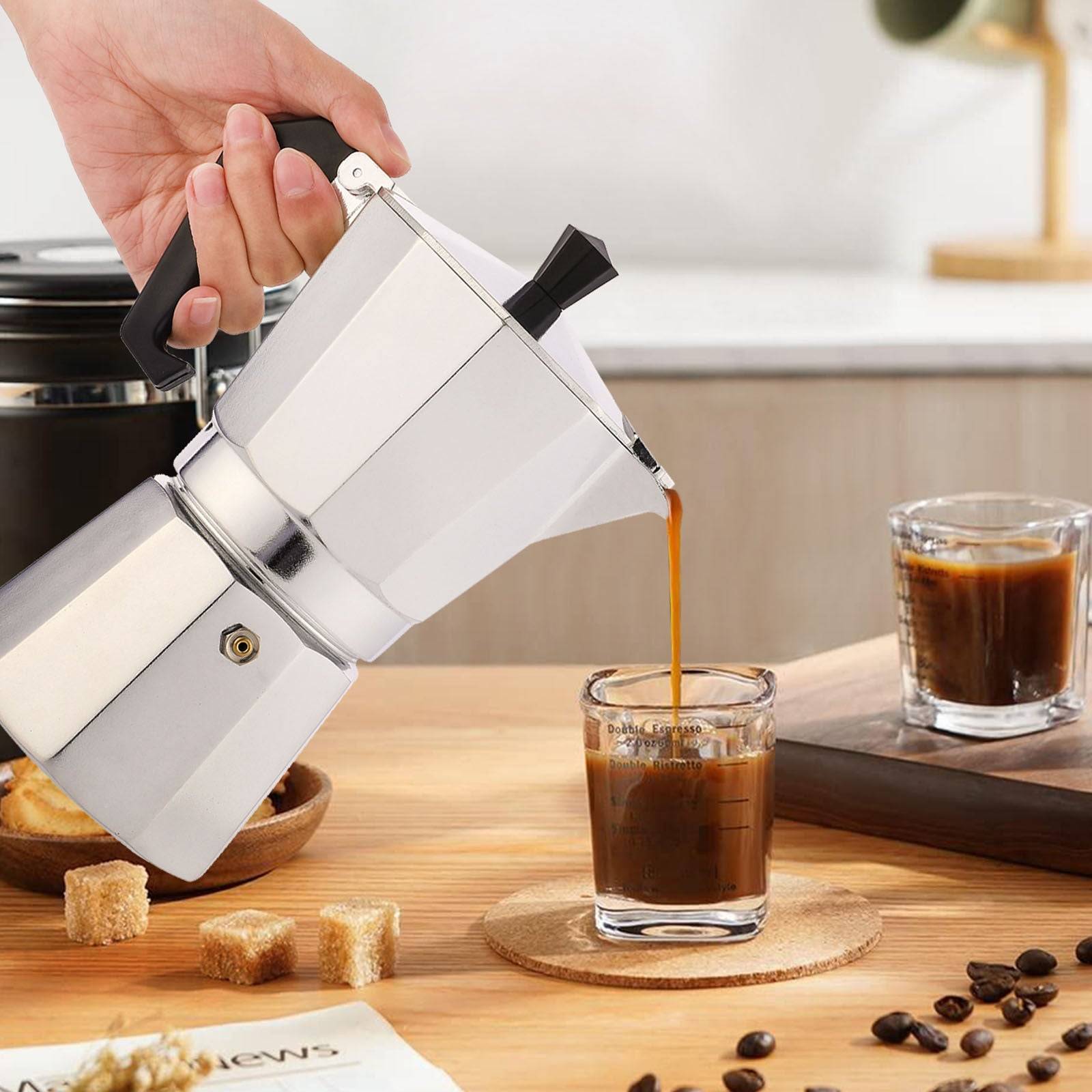 RAINBEAN Stovetop Espresso Maker brewing rich espresso into a glass cup. Classic Italian Moka pot design, perfect for making 3 cups of coffee.