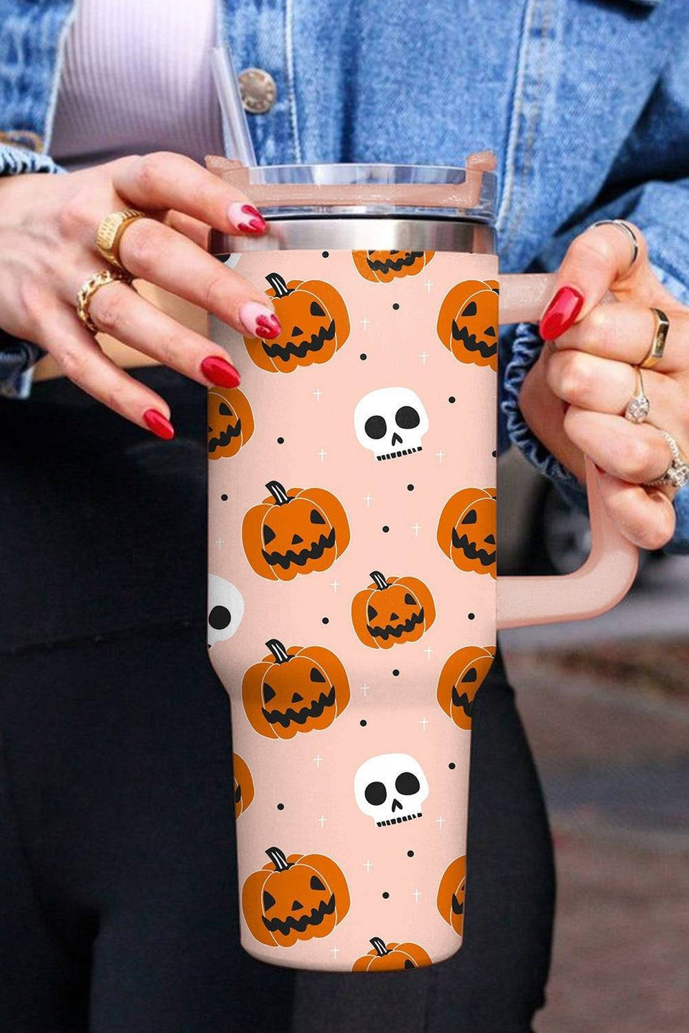 Large 1200ml thermal insulated water cup with straw, featuring a vibrant Halloween pumpkin design. Keeps drinks hot or cold for 24 hours.