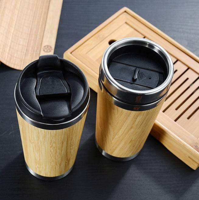 Bamboo coffee cup with 14oz capacity, featuring double-wall insulation and a non-slip grip. Eco-friendly, reusable, and ideal for sustainable living.