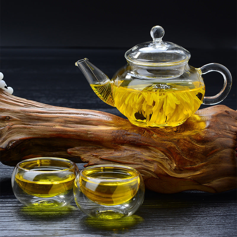 Elegant glass teapot showcasing tea brewing process"