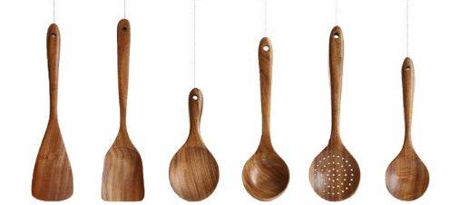 Teak wood kitchen utensil set from Thailand, featuring spoons, ladles, and turners. Durable and eco-friendly tableware for cooking and serving.