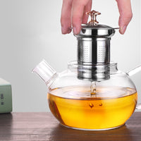 Elegant glass teapot showcasing tea brewing process"