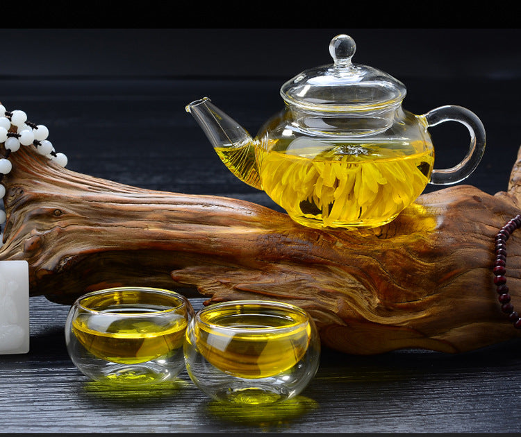 Large capacity glass teapot filled with brewed tea"