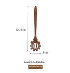 Wooden pasta spoon with three-slot scoop, 32.5cm length, 8cm width, on white background