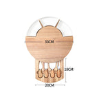 Wooden utensil holder with measurements on a white background