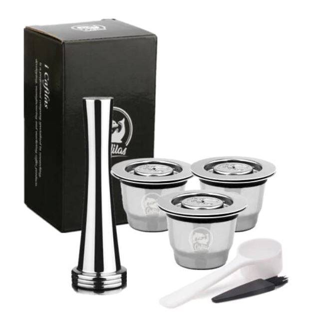 Reusable coffee pods set with stainless steel refillable capsule, tamper, cleaning brush, and scoop. Compatible with Nespresso machines for sustainable brewing.