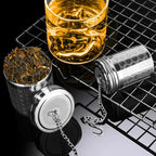 Tea infuser with locking lid and extended chain