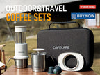 Portable 3-in-1 manual espresso maker in white and stainless steel, compact design with accessories, set against an outdoor backdrop.