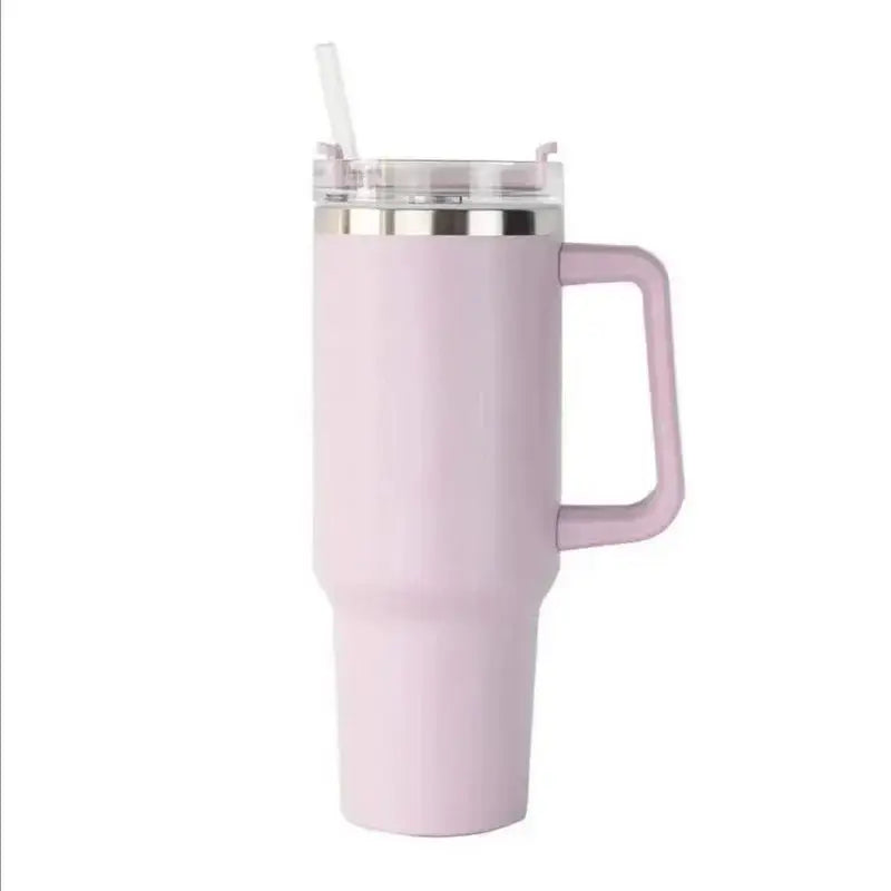 Pink insulated mug with handle and straw on a white background