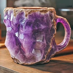 Colorful mineral crystal coffee mug with a unique purple resin design, featuring a textured surface and ergonomic handle.