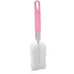 Bottle cleaning brush with pink handle and soft sponge head. Ideal for cleaning water bottles, baby bottles, and narrow containers with ease.