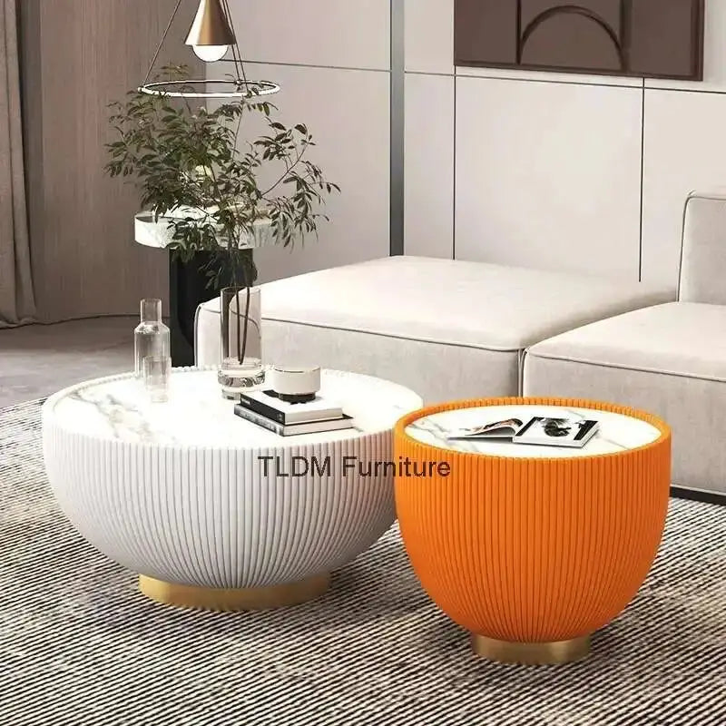 Two coffee tables, one white and one orange, in a living room setting with 'TLDM Furniture' branding.