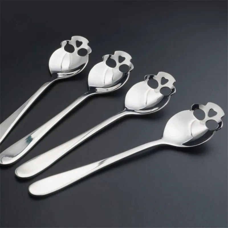 Set of four stainless steel skull spoons with a unique cutout design. Ideal for coffee, tea, and desserts, adding a stylish gothic touch.