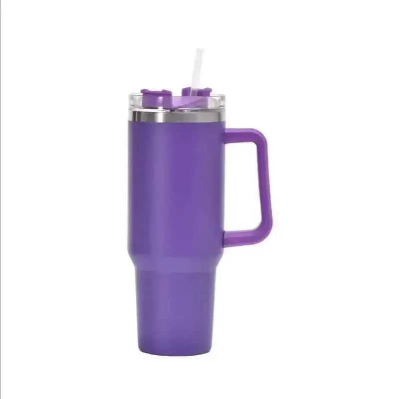 Purple insulated tumbler with handle and straw on a white background