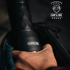 Portable Cafelffe 3-in-1 espresso maker held in a hand, featuring a sleek black design with a textured grip.