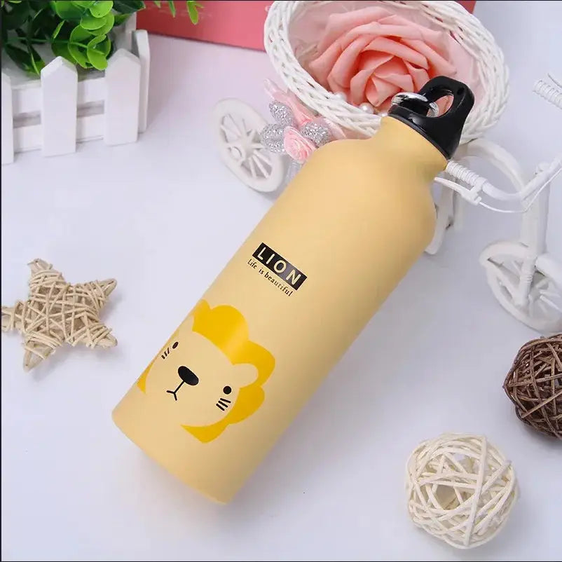 Yellow water bottle with lion design on a decorative background