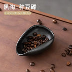 Ceramic coffee beans dosing cup with a speckled glaze finish, featuring a tapered spout for precise pouring. Ideal for measuring espresso beans with accuracy.
