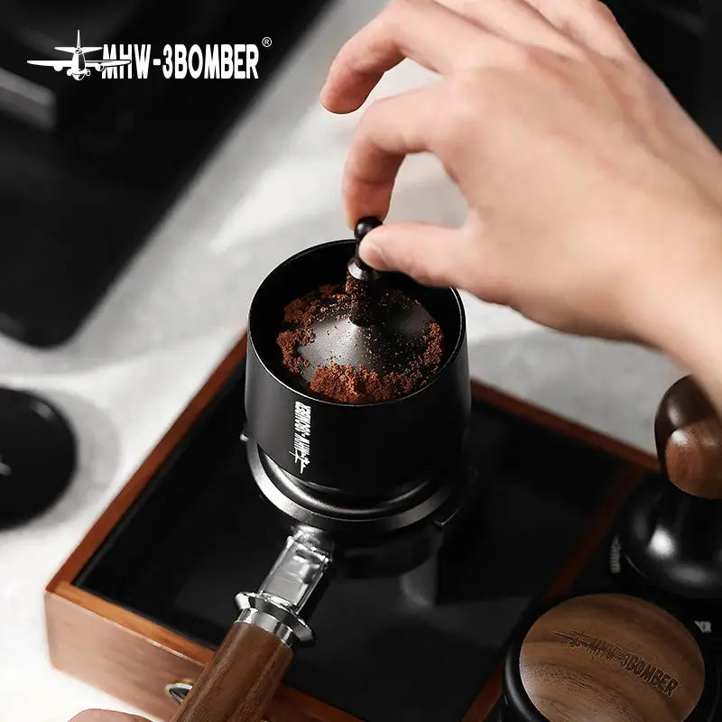 MHW-3BOMBER Coffee Dosing Funnel Aluminum Alloy Dosing Shaker dispensing grounds into a dripper, compatible with 51-54mm portafilters. Ideal espresso accessory for home baristas.