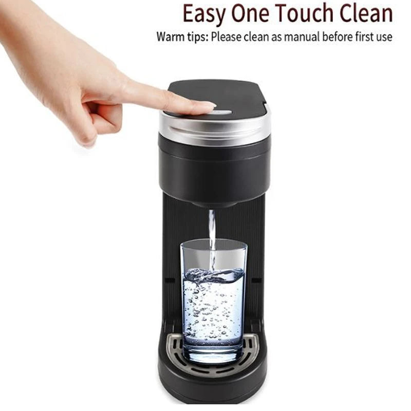 Black electric travel coffee maker with a silver top, dispensing water into a clear glass. Features one-touch control.