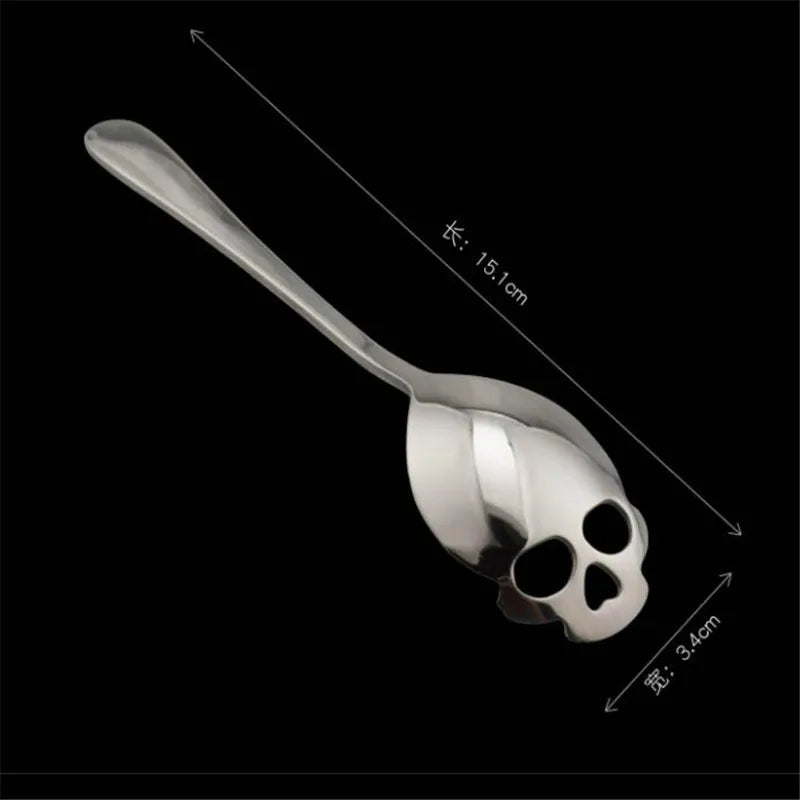 Stainless steel skull spoon with a 15.1cm length and 3.4cm width, featuring a unique cutout design. Ideal for coffee, tea, and dessert lovers.