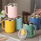Set of colorful insulated mugs with lids on a table.