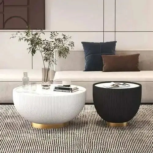 Modern living room with a white sofa, coffee table, and side table.