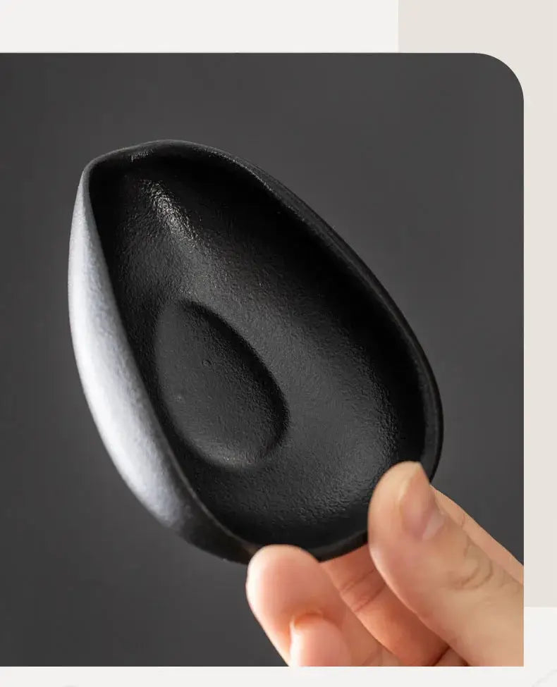 Ceramic coffee beans dosing cup with a speckled glaze finish, featuring a tapered spout for precise pouring. Ideal for measuring espresso beans with accuracy.