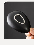 Ceramic coffee beans dosing cup with a speckled glaze finish, featuring a tapered spout for precise pouring. Ideal for measuring espresso beans with accuracy.