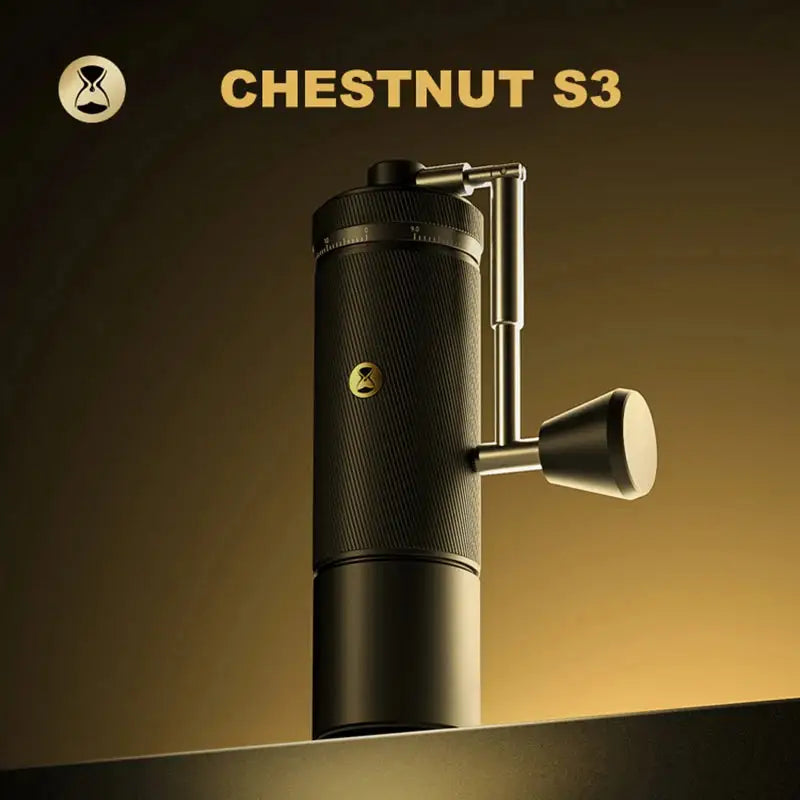 Chestnut S3 manual coffee grinder with sleek black design on gold gradient background
