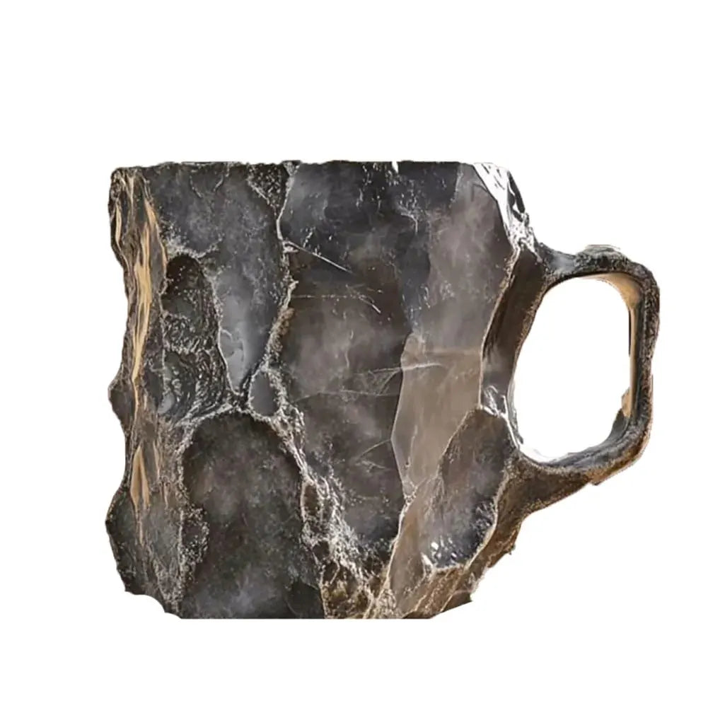 Mug made from a large, rough-textured stone on a white background