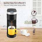 Electric travel coffee maker in black with a drip system, brewing coffee into a bright yellow mug.