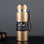 Gold stainless steel thermal water bottle with a leak-proof lid and carrying strap. Keeps drinks hot for 12 hours and cold for 24 hours, ideal for travel.