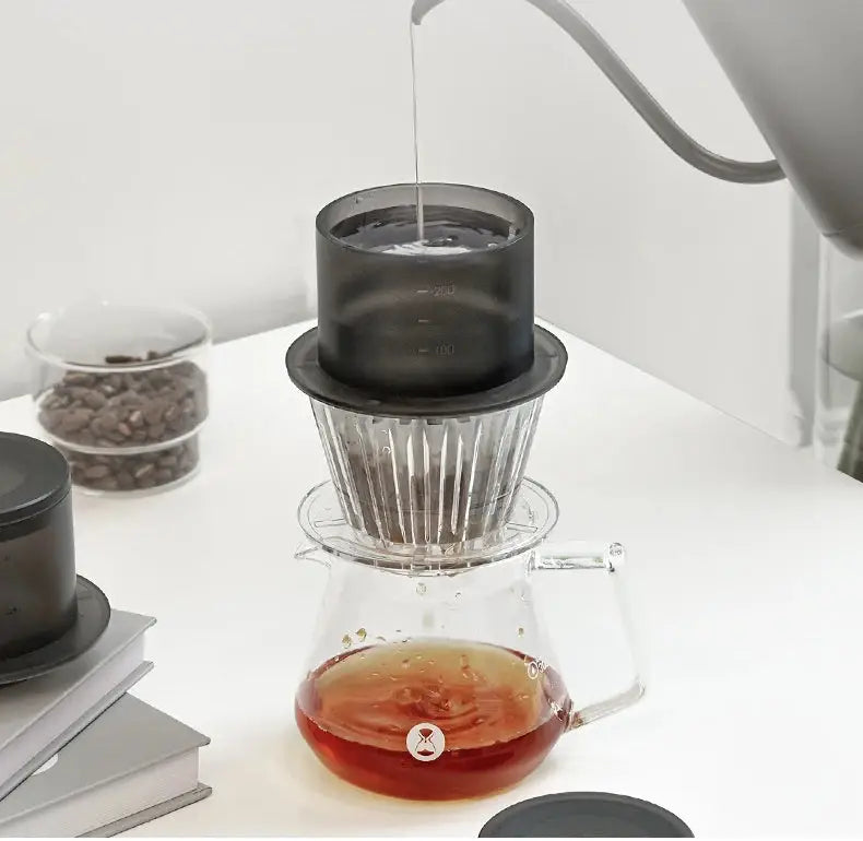Pour-over coffee brewing setup with the TIMEMORE SimpleDrip Water Dropper ensuring even water distribution for a perfect brew.