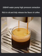 Coffee being extracted into a glass from a high pressure coffee machine.