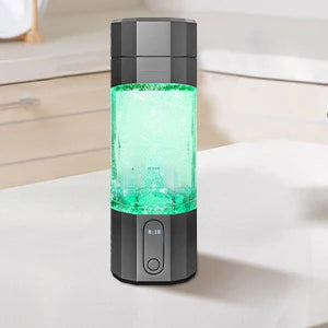 Black and gray portable water filter on a white surface