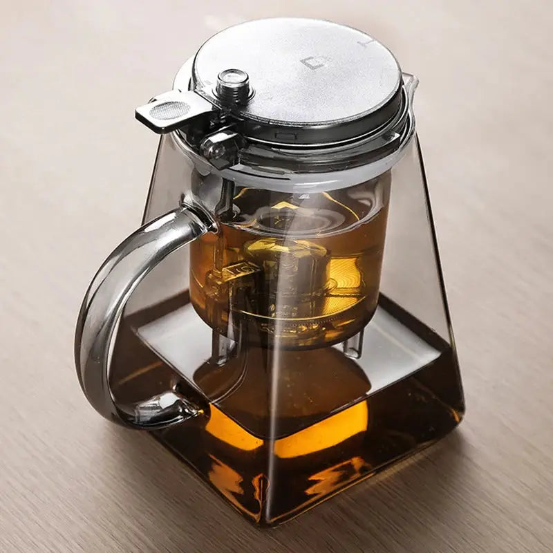 Elegant glass teapot with press tea strainer, featuring a heat-resistant design and water separation filter. Ideal for brewing loose-leaf, herbal, and flower teas.
