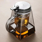 Elegant glass teapot with press tea strainer, featuring a heat-resistant design and water separation filter. Ideal for brewing loose-leaf, herbal, and flower teas.