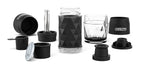 Portable coffee maker with black textured design, multiple components including a transparent water chamber, reusable capsules, and mixing accessories.