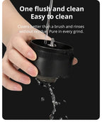 Easy-to-clean coffee grinder core being rinsed under water, ensuring no residue remains for a pure coffee grinding experience.