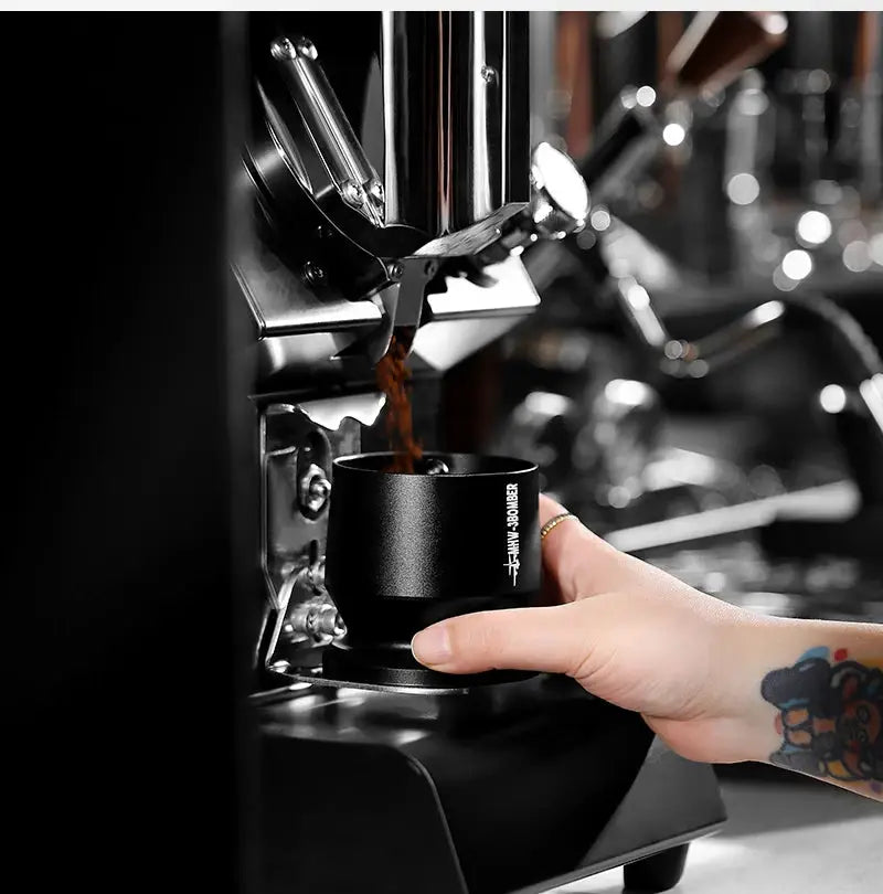 MHW-3BOMBER Coffee Dosing Funnel Aluminum Alloy Dosing Shaker in use with espresso machine, fits 51-54mm portafilters for home barista setup.
